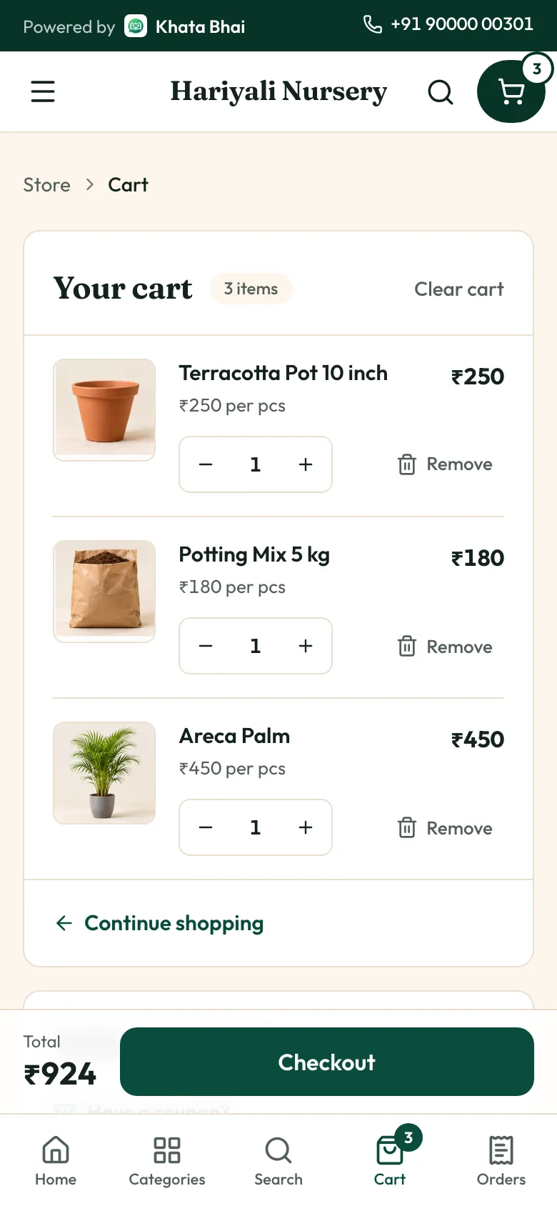 The same store on a phone, with three items in the cart and the total with GST